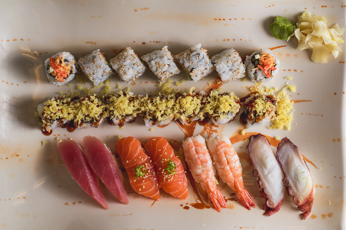 Assorted sushi, edamame, and a glass of Sauvignon Blanc at Sushi Nara (Credit: Jackie Tran)