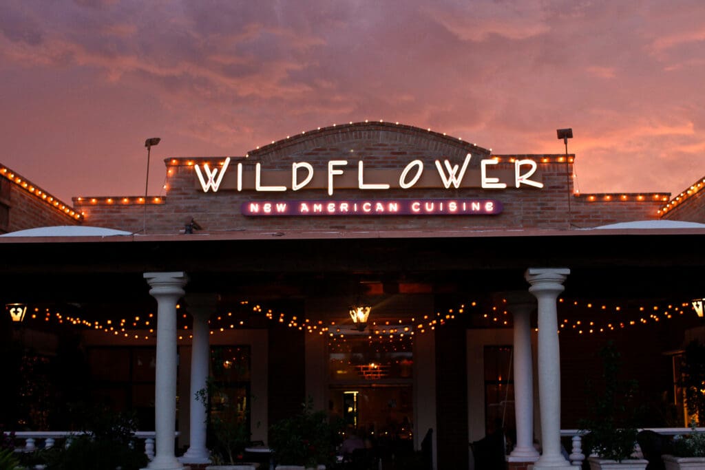 a sign in front of a building
