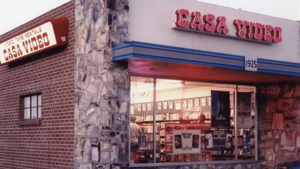 a sign above a store in a brick building