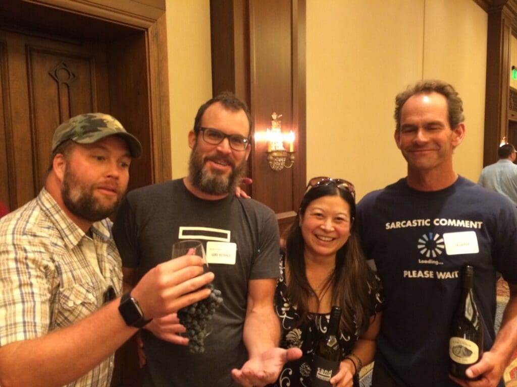 a group of people holding wine glasses