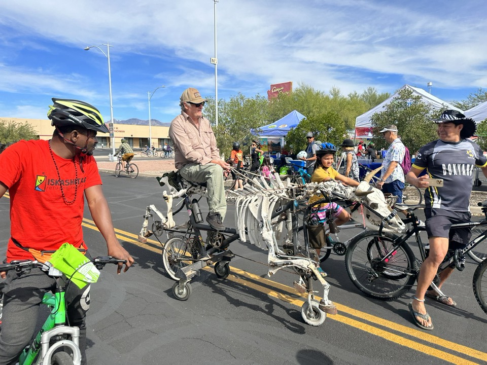 a group of people riding on the back of a motorcycle