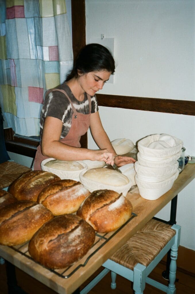 a person sitting at a table with food