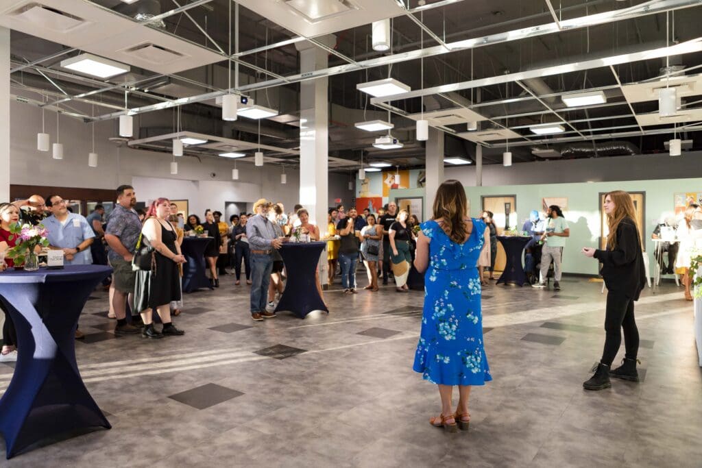 a group of people standing in a room