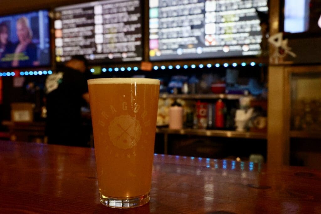 a glass of beer on a table