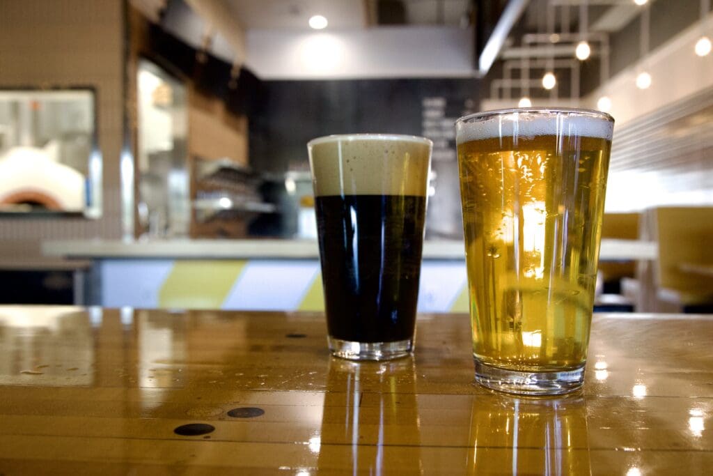 a glass of beer on a table
