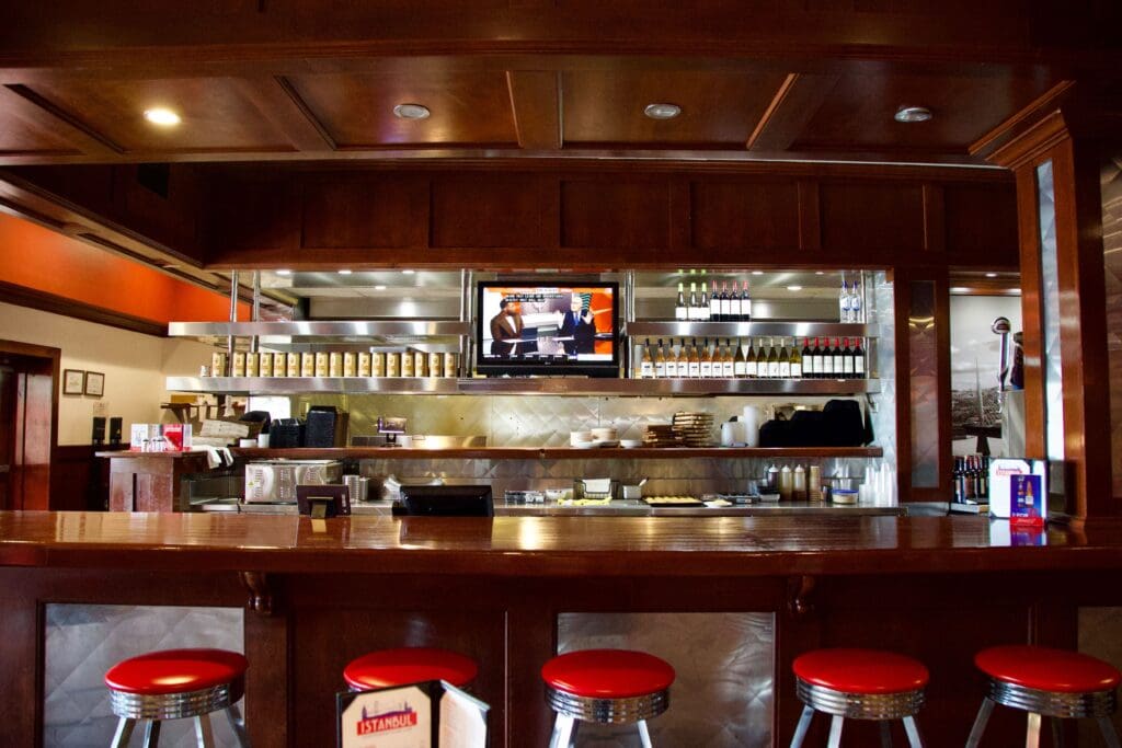 a kitchen with a table in a restaurant