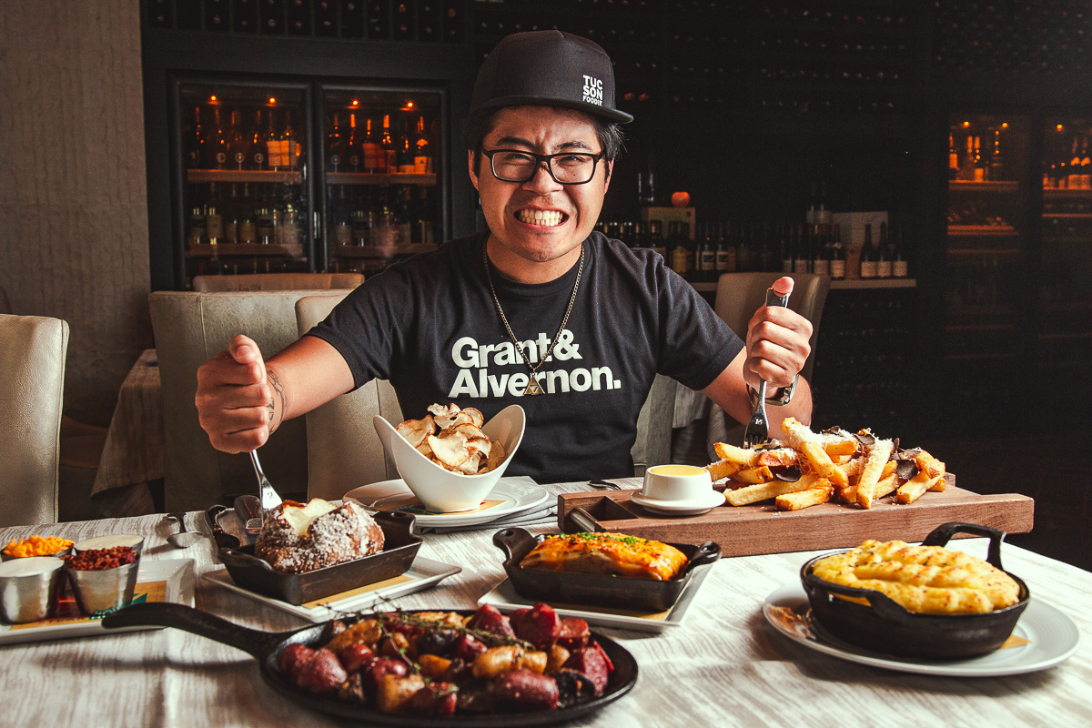 Jackie with $50 of potato dishes at PY Steakhouse (Credit: Jackie Tran)