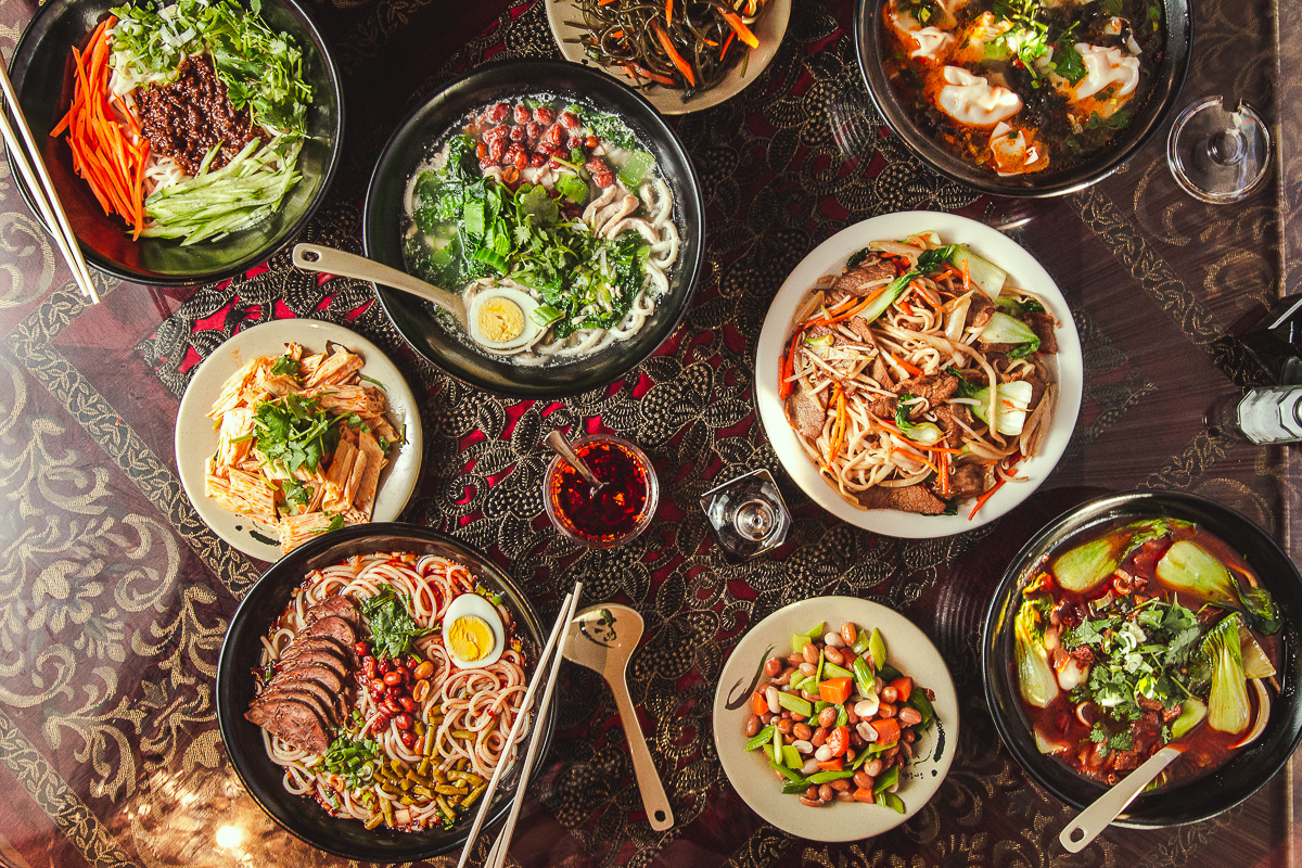Food spread at Just Noodles (Credit: Jackie Tran)