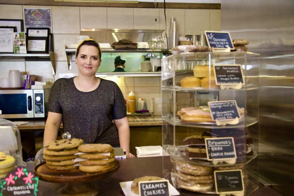 a person standing in a kitchen preparing food