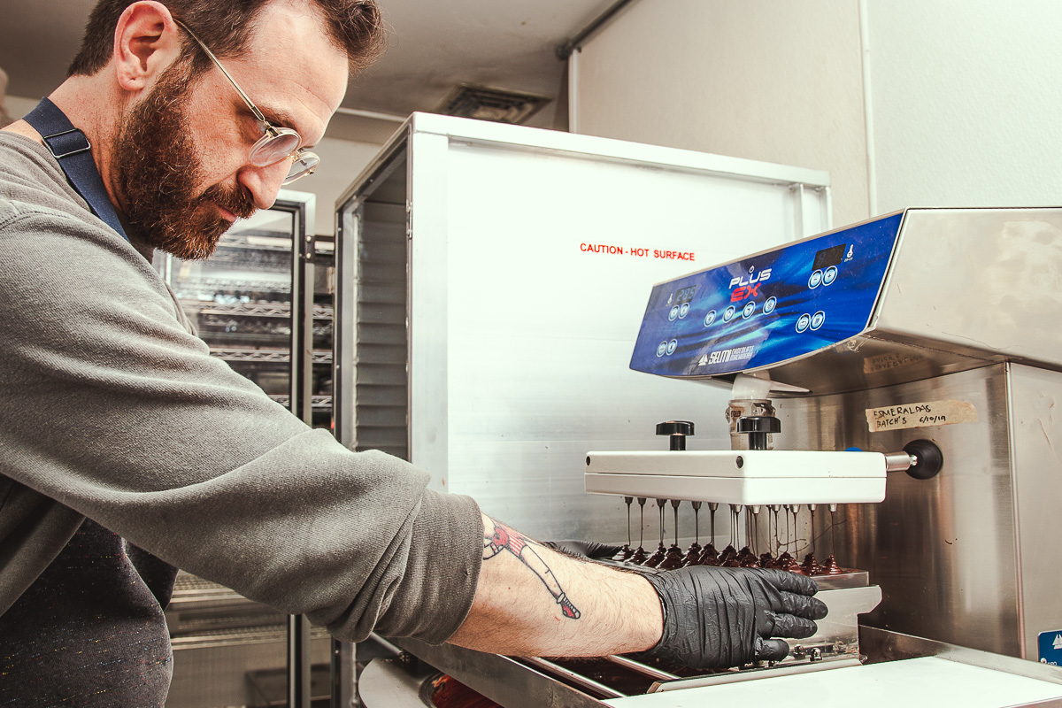 Adam Krantz making chocolate bars at Monsoon Chocolate (Credit: Jackie Tran)