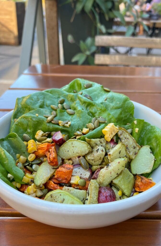 a bowl of food on a plate on a table