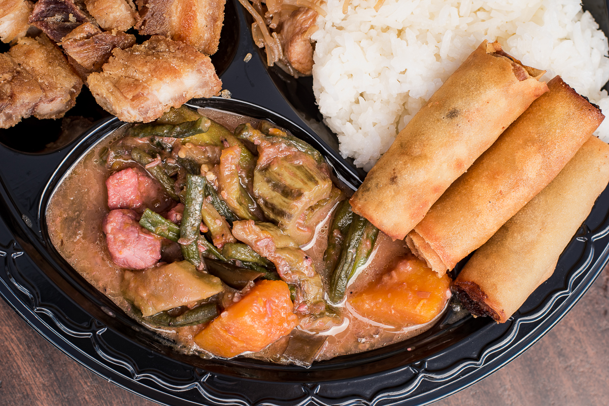Crispy pata, pancit, pinakbet, rice, and lumpia at Nick's Sari-Sari Store and Filipino Restaurant (Credit: Jackie Tran)