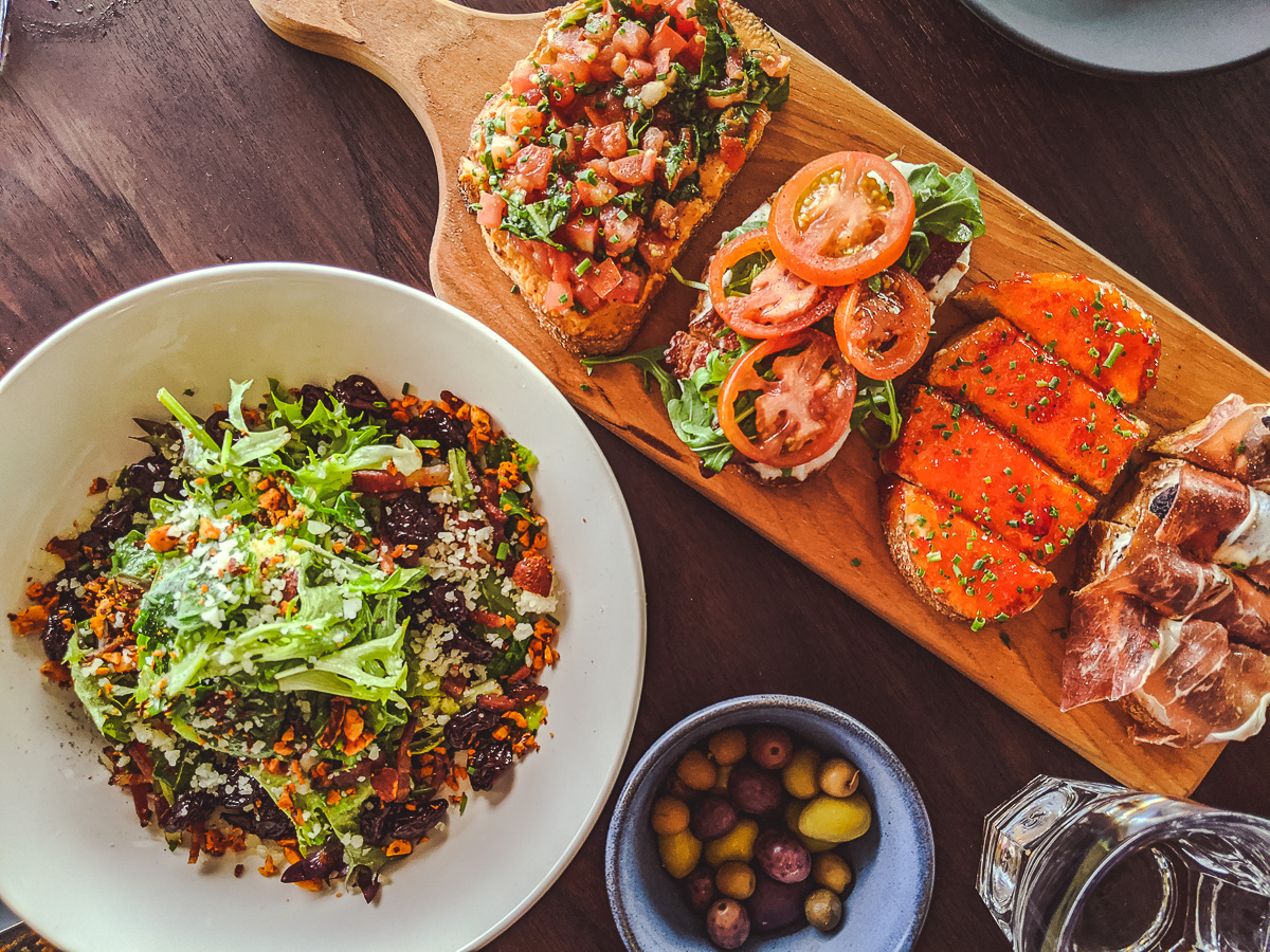 Bruschetta, Brussels Sprouts Salad, Olives at Postino WineCafe Tucson (Credit: Jackie Tran)