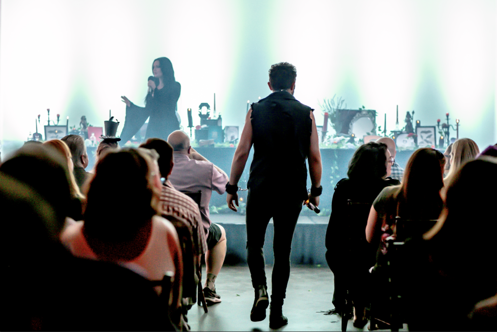 a group of people standing in front of a crowd