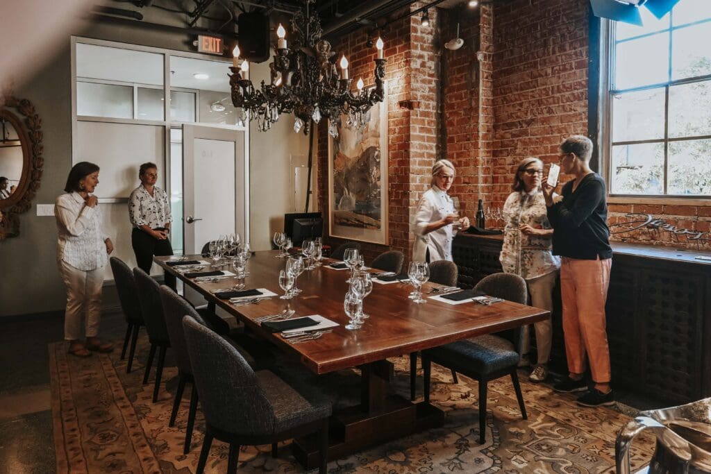 a group of people sitting at a table in a room