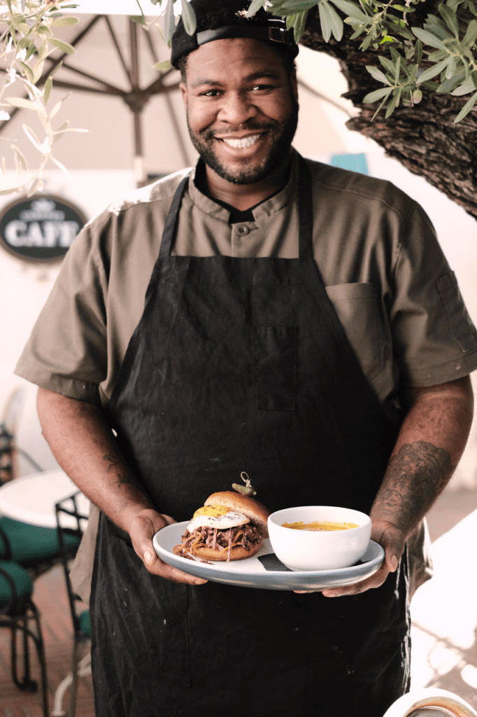 a man holding a plate of food