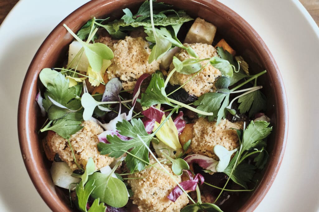 a bowl of salad on a plate