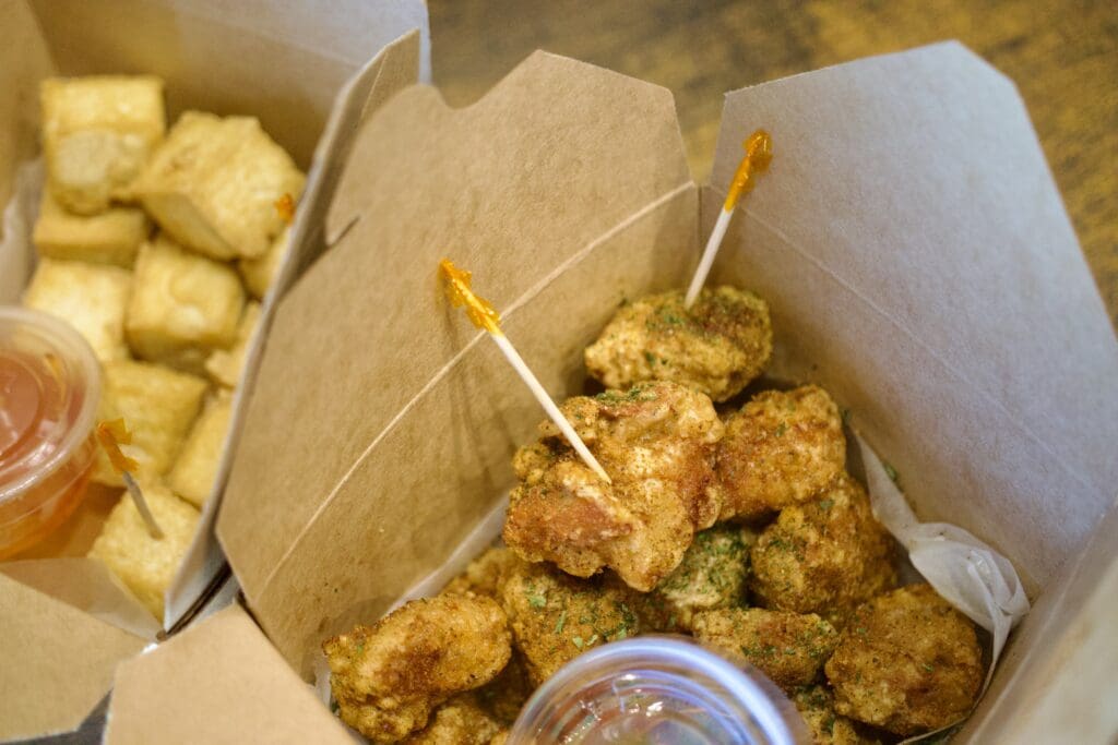 a box filled with different types of food on a table