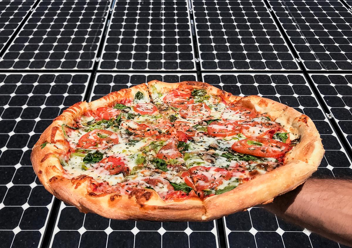 Vegetable Pizza in front of solar panels at Brooklyn Pizza Company (Credit: Claire Kaufman)
