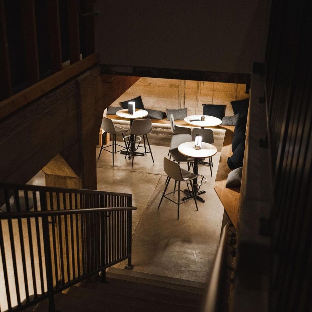 a kitchen with a table and chairs in a room